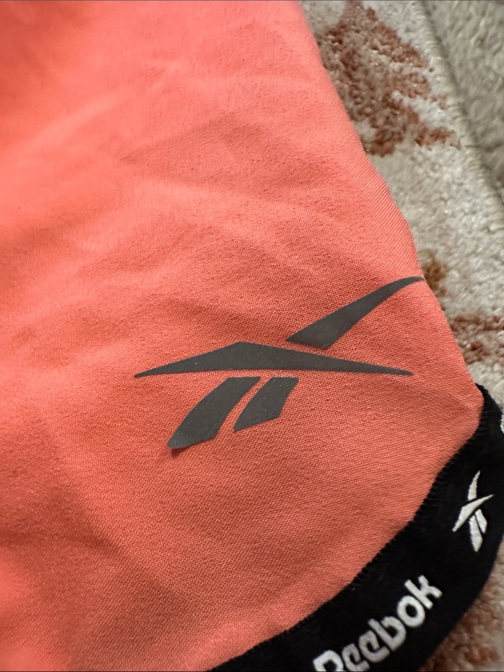 Reebok Women's Coral-Orange Athletic Shorts with Black Trim - Picture 2 of 6